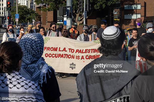 Jewish community members and allies hold a Shabbat, or Jewish Sabbath, celebration and solidarity ICE raids protest near the Wilshire Federal...