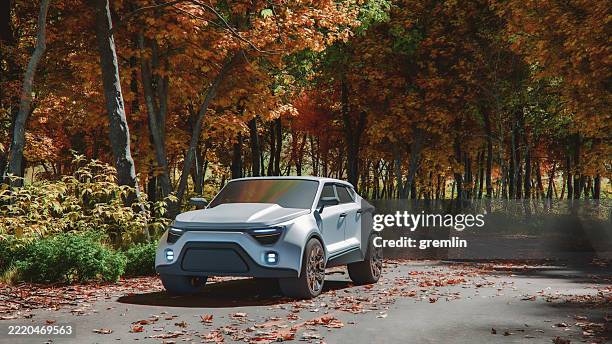 generic modern suv driving on rural road - suv front stock pictures, royalty-free photos & images