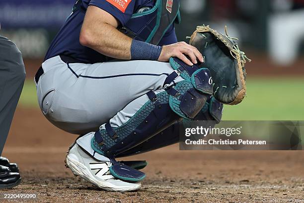 Catcher Cal Raleigh of the Seattle Mariners uses PitchCom during the MLB game at Chase Field on June 09, 2025 in Phoenix, Arizona. The Diamondbacks...