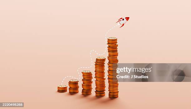 trajectory of success – rocket ignites from peak of coin stack growth chart in symbol of financial breakthrough - rente stockfoto's en -beelden