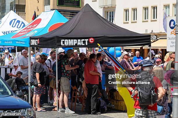 June 2025, Saxony-Anhalt, Magdeburg: A pavilion of the far-right magazine COMPACT stands on the Alter Markt during the continuation of an AfD...