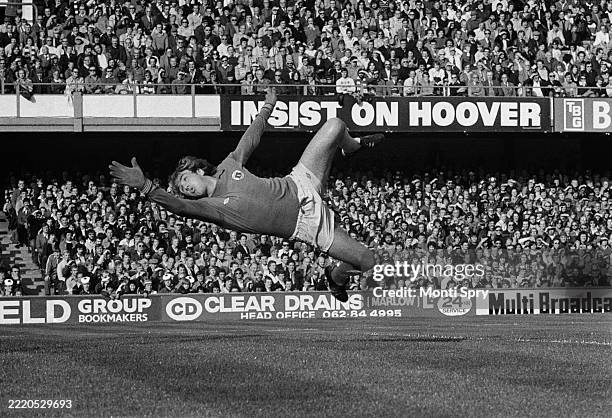 British footballer George Wood, the Everton goalkeeper, dives to make a save during the First Division match between Queens Park Rangers and Everton,...