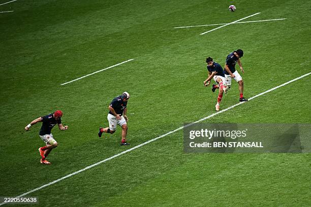 France's fly half Antoine Hastoy kicks the ball to start the second half of the Rugby Union International Test match between England and France at...