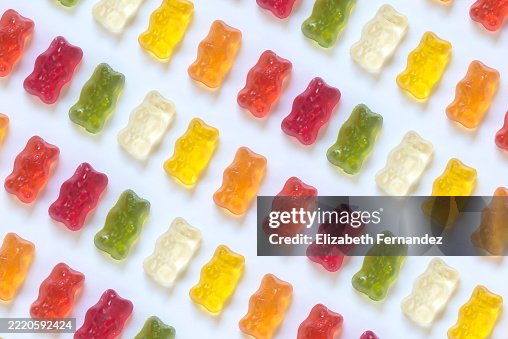 Colorful Gummy Bears Arranged in Diagonal Pattern on White Background Colorful Gummy Bears Arranged in Diagonal Pattern on White Background
