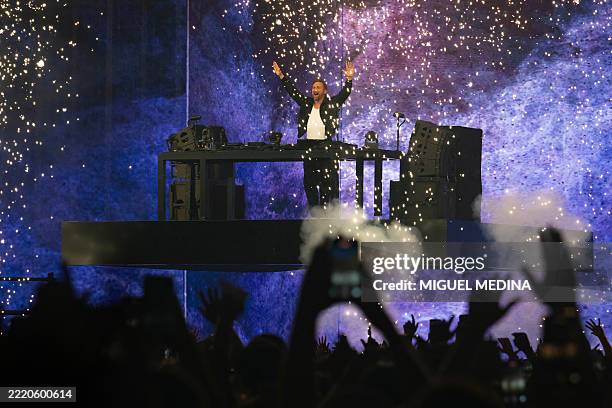 French DJ, composer and producer David Guetta performs on stage during a concert held on the occasion of France's annual street music festival, 'Fete...