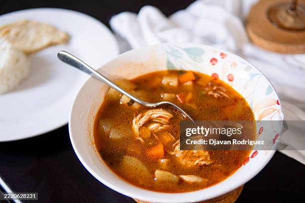 a close up of a chicken soup over a table. nature and organic food concept. - alimentos cocinados fotografías e imágenes de stock