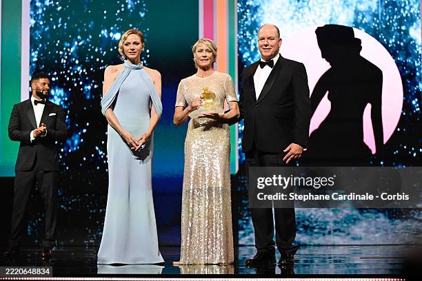 Robin Wright received the Cristal Nymph Award from Princess Charlene of Monaco and Prince Albert II of Monaco during the Closing Ceremony during 64th...