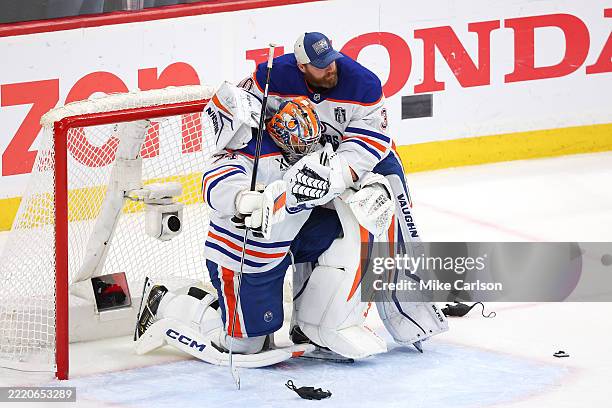 Stuart Skinner of the Edmonton Oilers is hugged by Calvin Pickard following their team's defeat against the Florida Panthers in Game Six of the 2025...