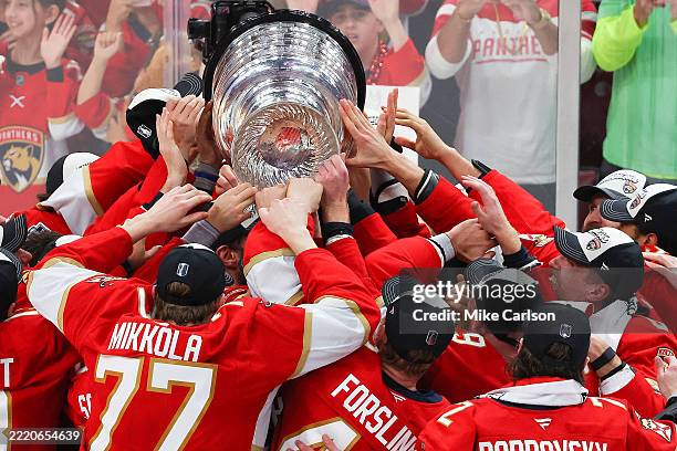 The Florida Panthers celebrate with the Stanley Cup after defeating the Edmonton Oilers in Game Six of the 2025 Stanley Cup Final at Amerant Bank...