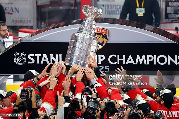 The Florida Panthers celebrate with the Stanley Cup after defeating the Edmonton Oilers 5-1 in Game Six of the 2025 Stanley Cup Final at Amerant Bank...