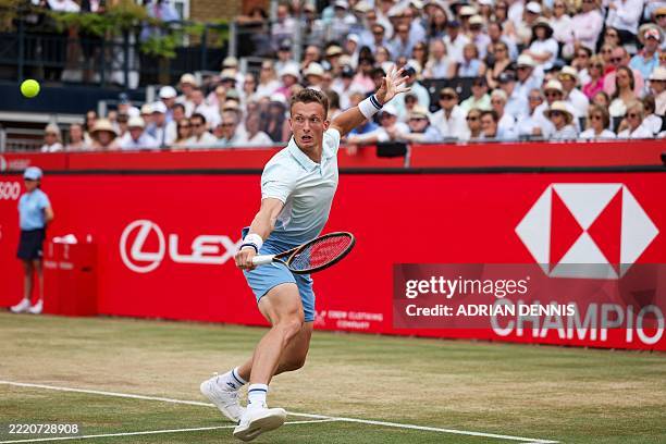 Czech Republic's Jiri Lehecka plays a backhand return to Spain's Carlos Alcaraz during their men's singles final tennis match at the HSBC ATP tennis...