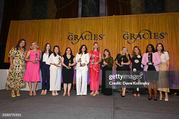 Juju Chang and Erica Hill pose with recipients during the Gracie Awards Luncheon presented by the Alliance for Women in Media Foundation on June 18,...