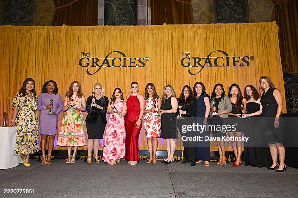 Juju Chang and Becky Brooks pose with recipients during the Gracie Awards Luncheon presented by the Alliance for Women in Media Foundation on June...