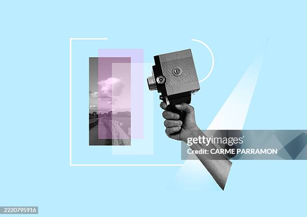 a hand with an old recording analog camera. - vintage film stock illustrations