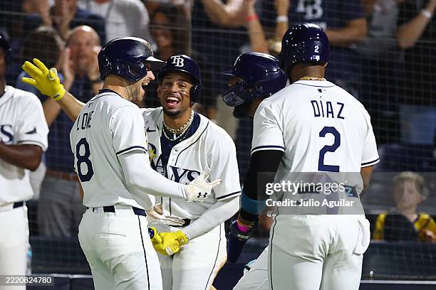 Brandon Lowe of the Tampa Bay Rays celebrates with Christopher Morel, Junior Caminero and Yandy Díaz after hitting a two-run home run in the fifth...