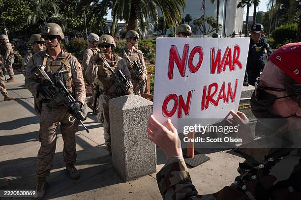Marines stand guard at the Westwood Federal Building complex as demonstrators protest U.S. Involvement in the Israel/Iran conflict on June 18, 2025...