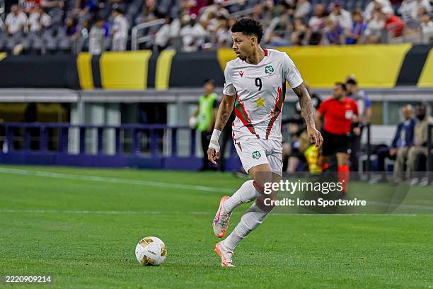 Suriname forward Richonell Margaret dribbles the ball during the Concacaf Gold Cup Group stage match between the Dominican Republic and Suriname on...