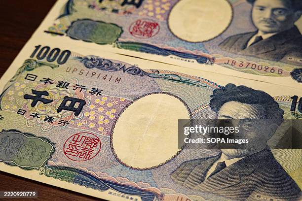 In this photo illustration, Japanese 1,000 - yen banknotes are seen.