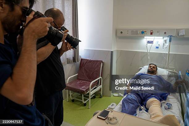 Saeed Hamidi who was injured in an Israeli strike in Tehran that killed his wife and daughter, is visited by journalists as he spends a fifth day...