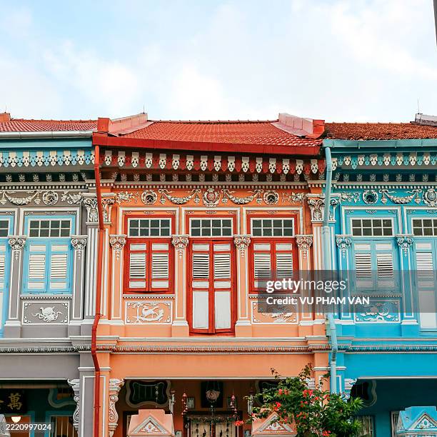 vibrant facade of peranakan culture shophouses - urban exploration stock pictures, royalty-free photos & images