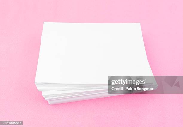 stack of blank white a4 size paper sheets on pink color background. - sample text stock pictures, royalty-free photos & images