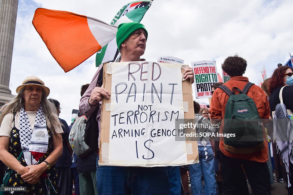 Protestet A protester holds a placard in support of Palestine Action group who ...
