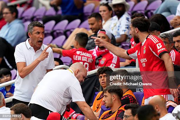 Bruno Lage , Head Coach of SL Benfica, argues with Orkun Koekcu of SL Benfica on the bench after Koekcu was shown a yellow card during the FIFA Club...