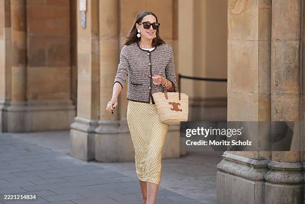 Annette Weber is seen wearing yellow Allora beaded fitted midi skirt with a mix of glass bugle beads and sequins in a scaly pattern from Veronica...