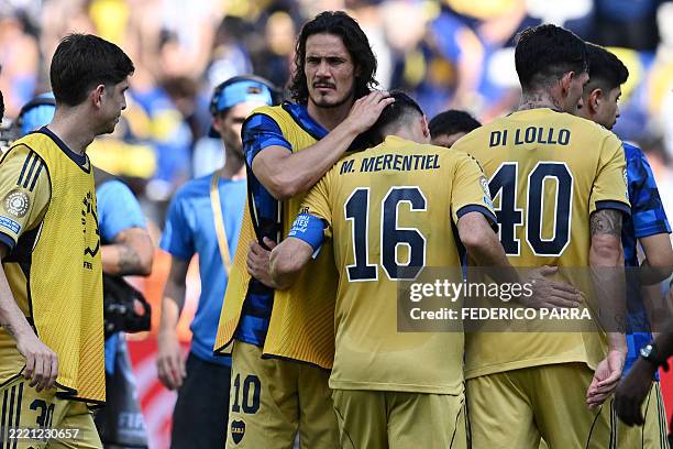 Boca Juniors' Uruguayan forward Edinson Cavani and teammate Uruguayan forward Miguel Merentiel react at the end of the FIFA Club World Cup 2025 Group...