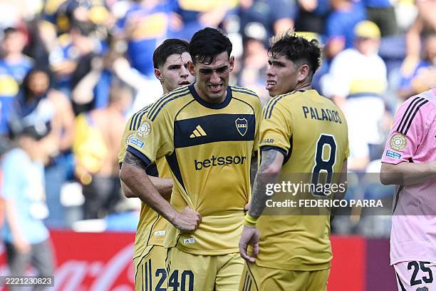 Boca Juniors' Argentine defender Lautaro Di Lollo and teammate Chilean midfielder Carlos Palacios react at the end of the FIFA Club World Cup 2025...
