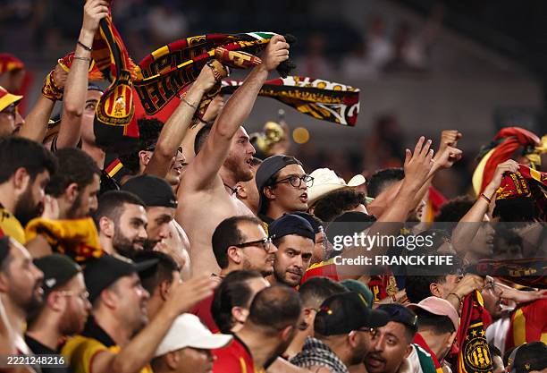 Esperance fans cheer up during the FIFA Club World Cup 2025 Group D football match between Tunis' Esperance Sportive de Tunis and England's Chelsea...