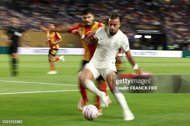 Chelsea's French defender Malo Gusto and Esperance's Tunisian defender Mohamed Ben Ali fight for the ball during the FIFA Club World Cup 2025 Group D...