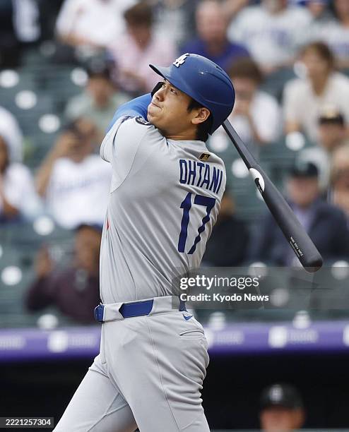 Los Angeles Dodgers designated hitter Shohei Ohtani flies out in the first inning of a baseball game against the Colorado Rockies at Coors Field in...
