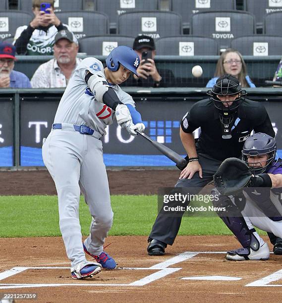 Los Angeles Dodgers designated hitter Shohei Ohtani flies out in the first inning of a baseball game against the Colorado Rockies at Coors Field in...