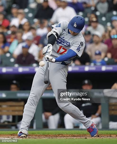 Los Angeles Dodgers designated hitter Shohei Ohtani flies out in the third inning of a baseball game against the Colorado Rockies at Coors Field in...