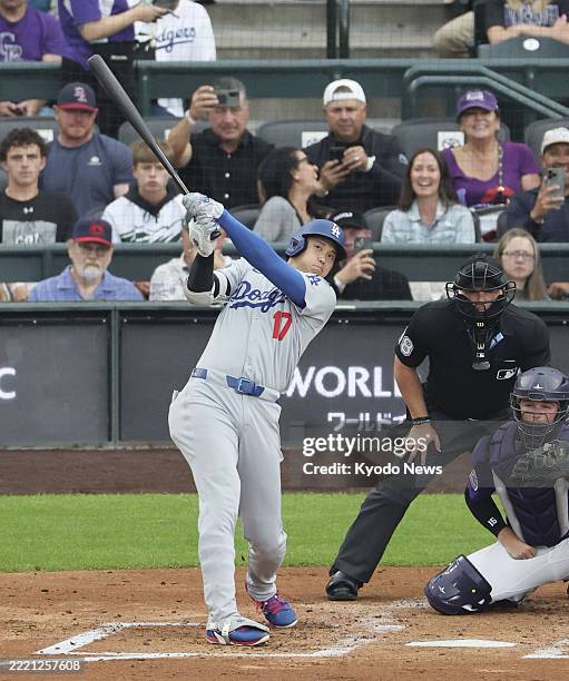 Los Angeles Dodgers designated hitter Shohei Ohtani flies out in the third inning of a baseball game against the Colorado Rockies at Coors Field in...