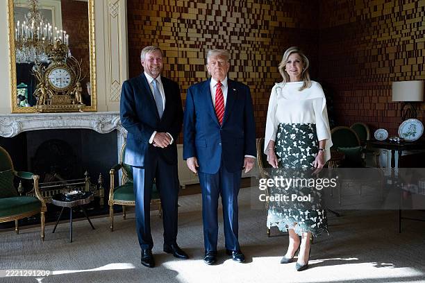 President Donald Trump poses with King Willem-Alexander of the Netherlands and Queen Maxima at Paleis Huis ten Bosch on the sidelines of the NATO...