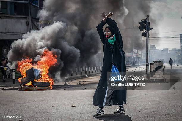 Protester reacts in front of a burning barricade in downtown Nairobi on June 25, 2025 during a planned day of protest marking the first anniversary...