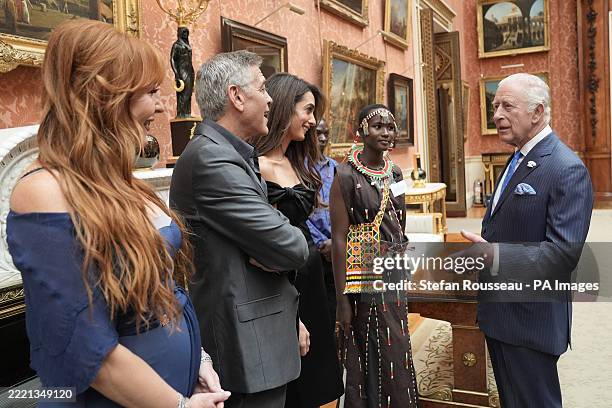 King Charles III speaks with Charlotte Tilbury, George and Amal Clooney and Alice, during a reception for the winners of the King's Trust Awards 2025...