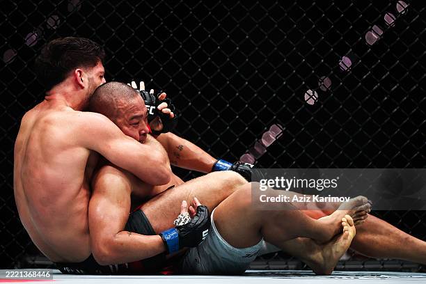 Ismail Naurdiev of Russia and JunYong Park of South Korea exchange punches in their middleweight fight during the UFC Fight Night event at Baku...