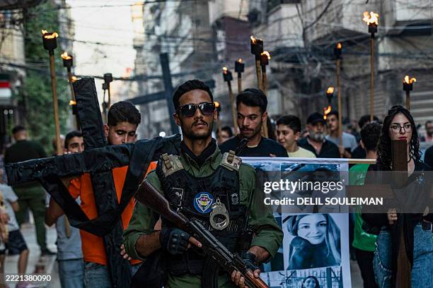 Member of the Sutoro police, a Christian police force working in concert with the Kurdish Internal Security Force of Asayesh, accompanies a march...