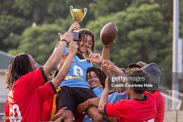 high school athletes celebrate winning trophy after flag football tournament - sports league stock pictures, royalty-free photos & images