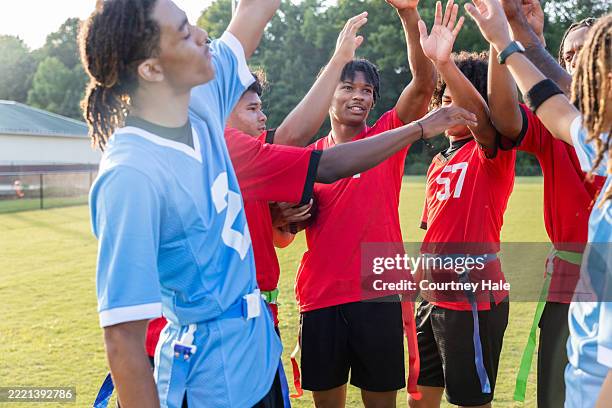 Flag football team huddle at the Academy