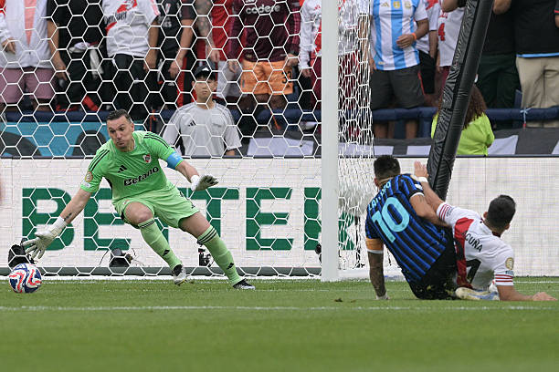River Plate's Argentine goalkeeper Franco Armani stops a goal attempt by Inter Milan's Argentine forward Lautaro Martinez during the FIFA Club World...