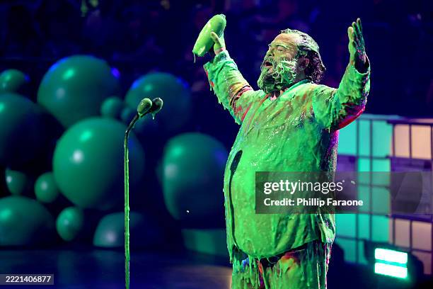 Honoree Jack Black gets slimed while accepting the King of Comedy award onstage during the Nickelodeon Kids' Choice Awards 2025 at Barker Hangar on...