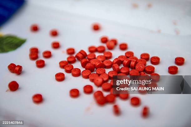 Pills of methamphetamine are displayed before being set on fire during a destruction ceremony to mark the United Nations' "International Day against...