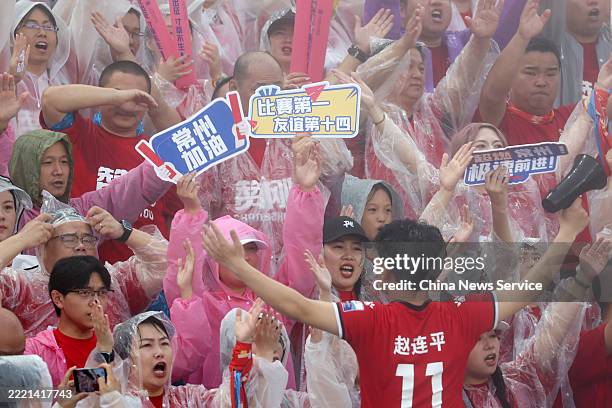 Football fans cheer for players during the 5th round match between Changzhou team and Nanjing team at the 2025 Jiangsu Football City League on June...