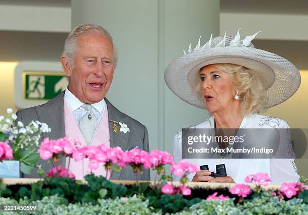 King Charles III and Queen Camilla watch their horse 'Purple Rainbow' run in the Sandringham Stakes as they attend day four of Royal Ascot at Ascot...