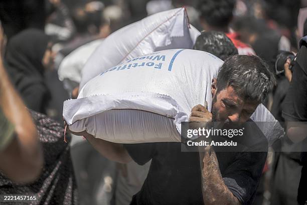 Flour sacks are being distributed to Palestinians from the World Health Organization warehouse, in Gaza City, Gaza on June 26, 2025.