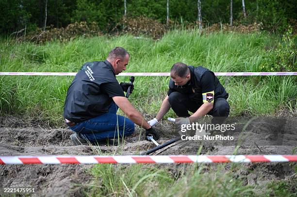 Participants attend the ''Future of Demining: Ukraine in Action'' exhibition at the Ukrainian Training and Testing Complex in Lviv region, Ukraine,...